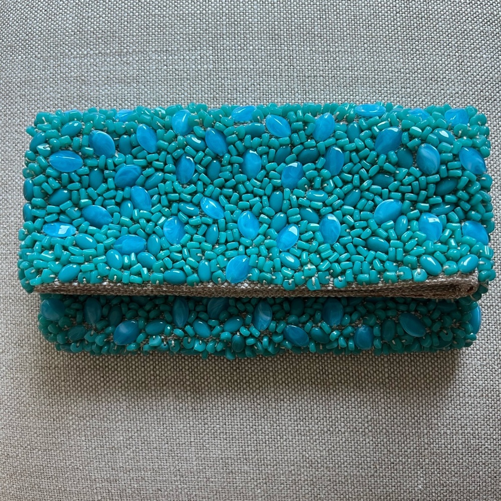 Beaded turquoise colored fold-over clutch.